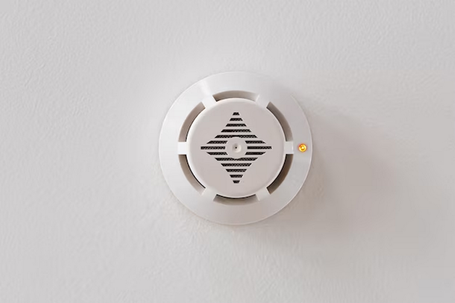 smoke detector on the white ceiling