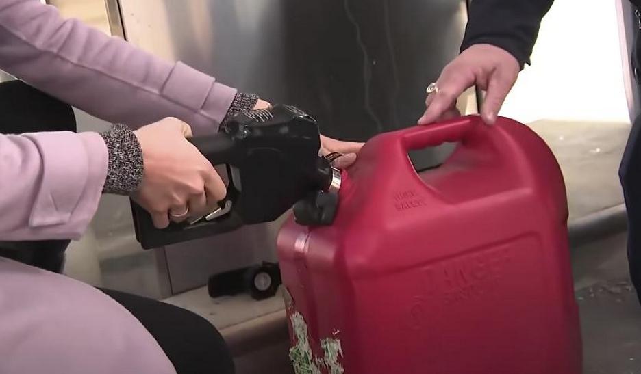 Diesel being poured into a gallon container