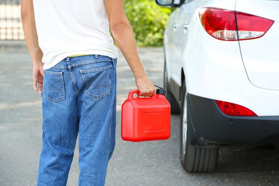 Person with a fuel gallon