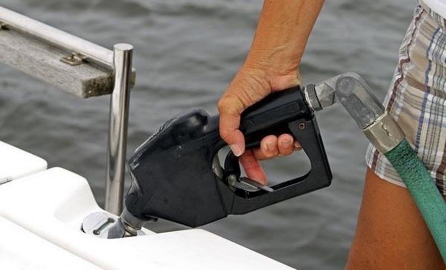 Man filling a boat with gasoline, close-up